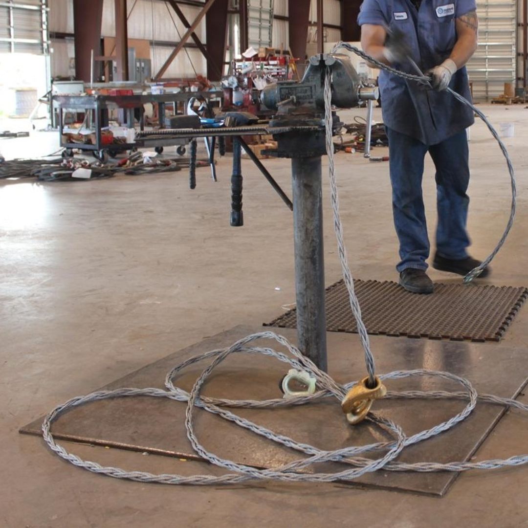 man using wire rope sling